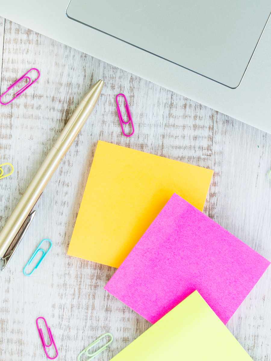sticky notes, paperclips and pen